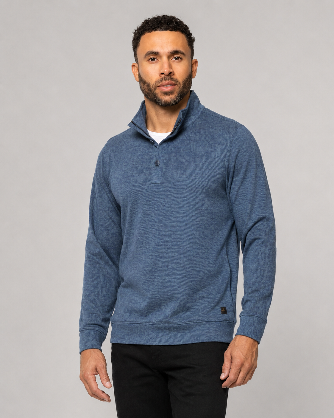 Indigo blue knit mock-neck pullover with button placket, long sleeves, chest pocket