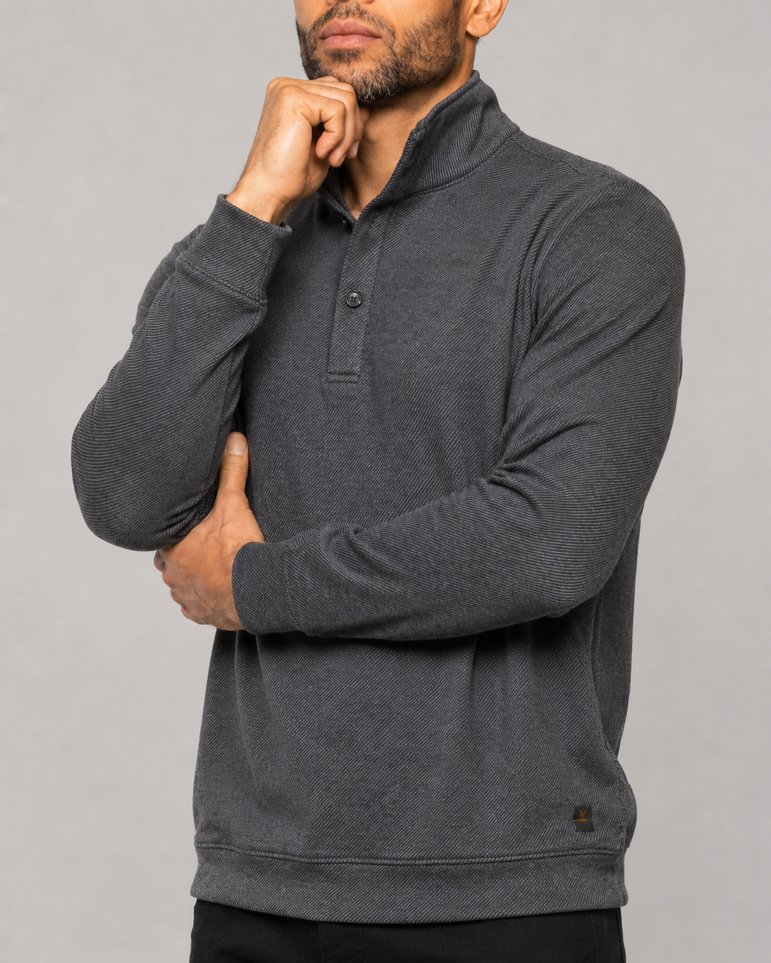 Men's dark mock-neck pullover, button placket and kangaroo pocket detail