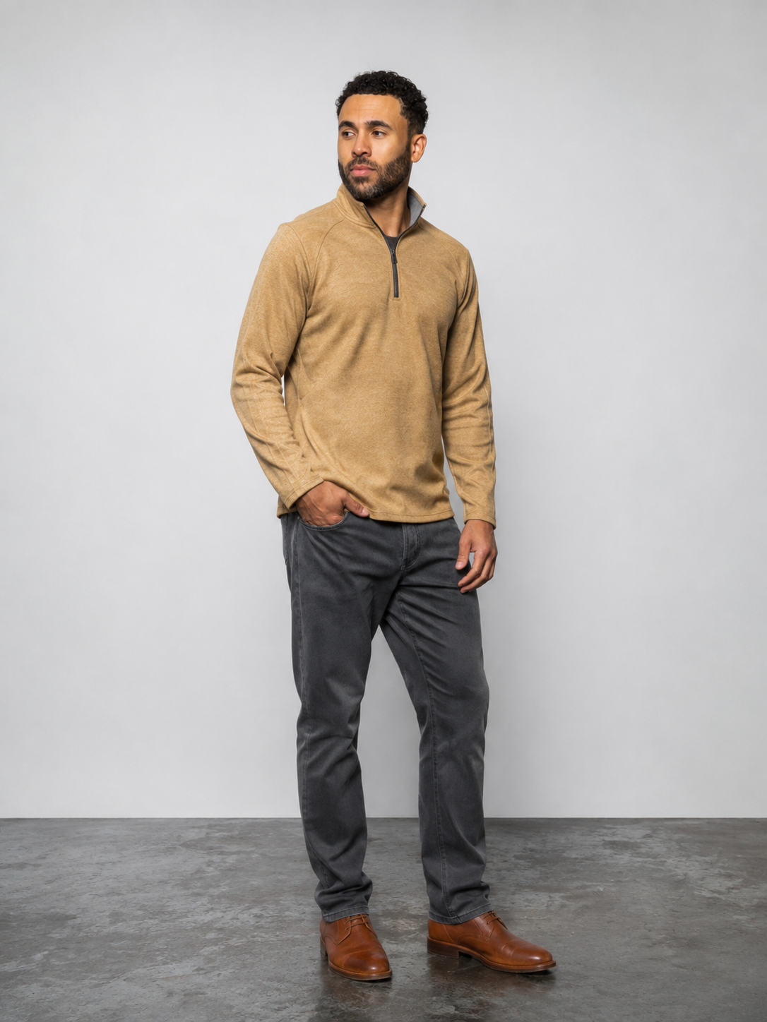 Mens tan quarter-zip pullover with black zipper, long sleeves, and ribbed cuffs