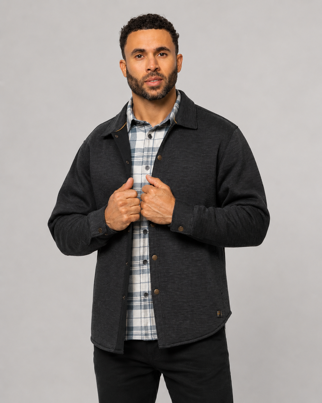 Dark shirt jacket with point collar, button front, and chest pocket; long sleeves