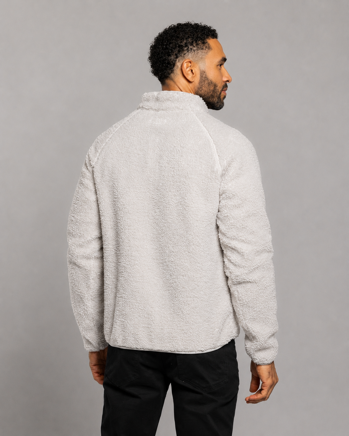 Light gray quarter-zip fleece pullover, back view with stand collar and long sleeves.