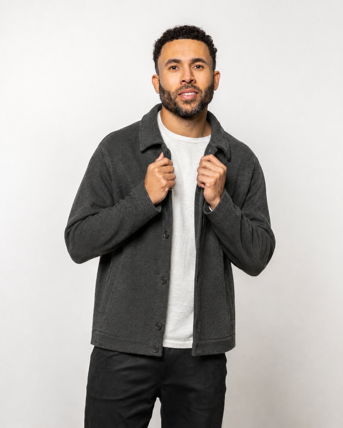 Men's dark gray button-front jacket with spread collar and long sleeves