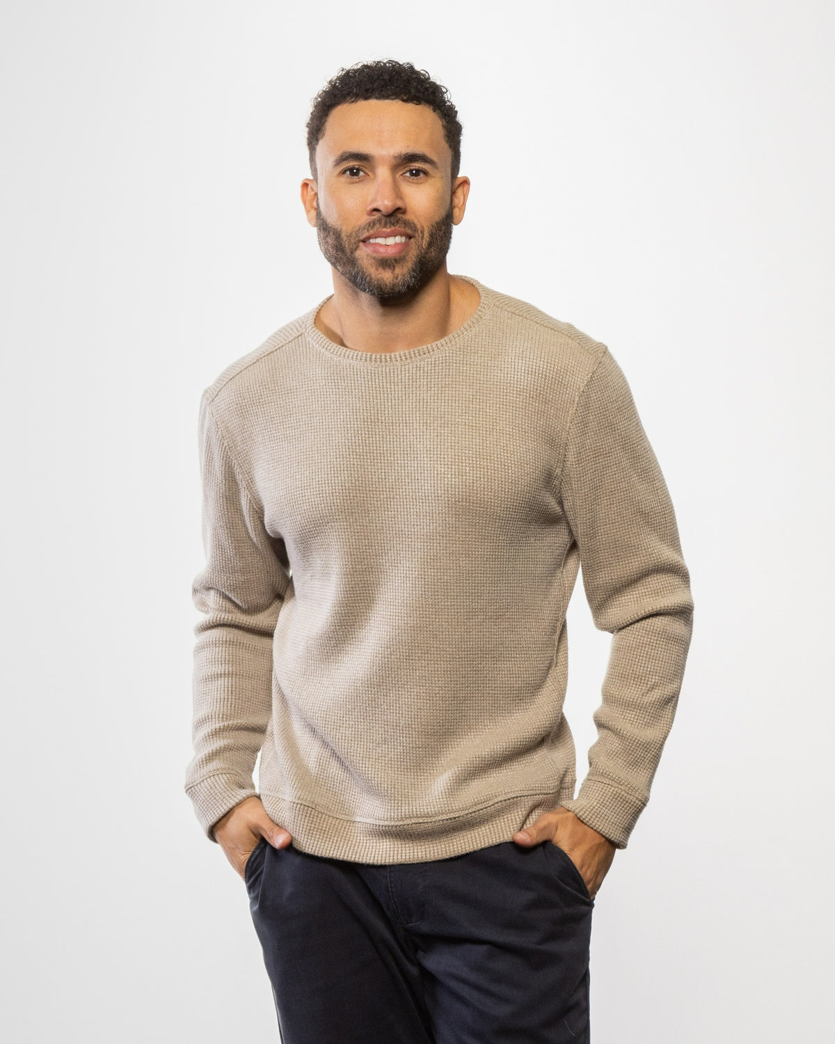 Men's crewneck sweater, tan knit with long sleeves and ribbed cuffs and hem