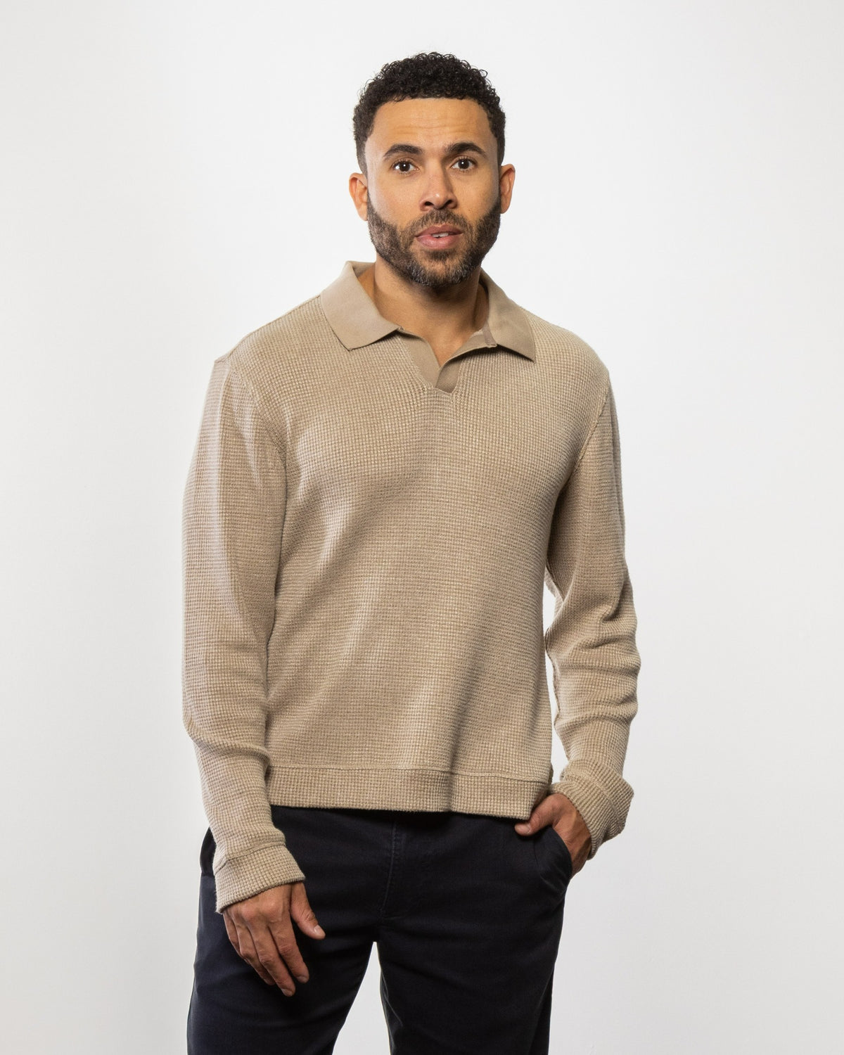 Beige knit polo sweater with long sleeves and collar