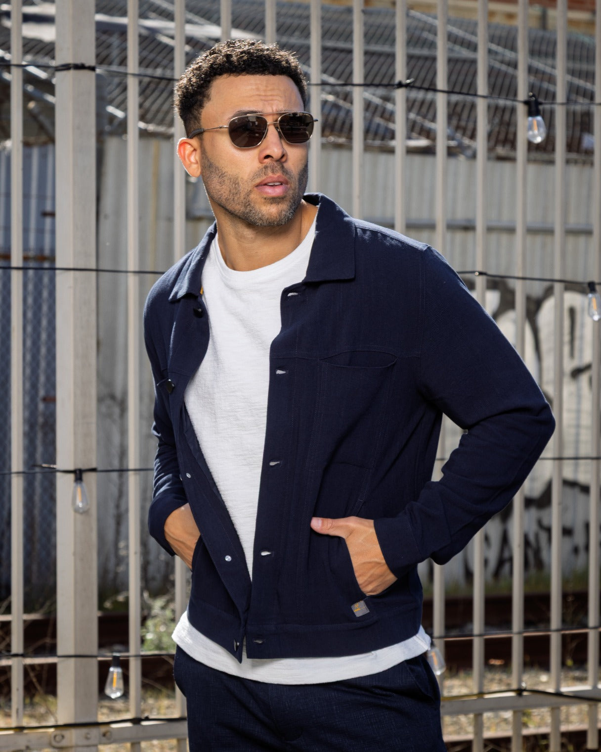 Indigo trucker jacket with button-front, collar, and chest flap pockets