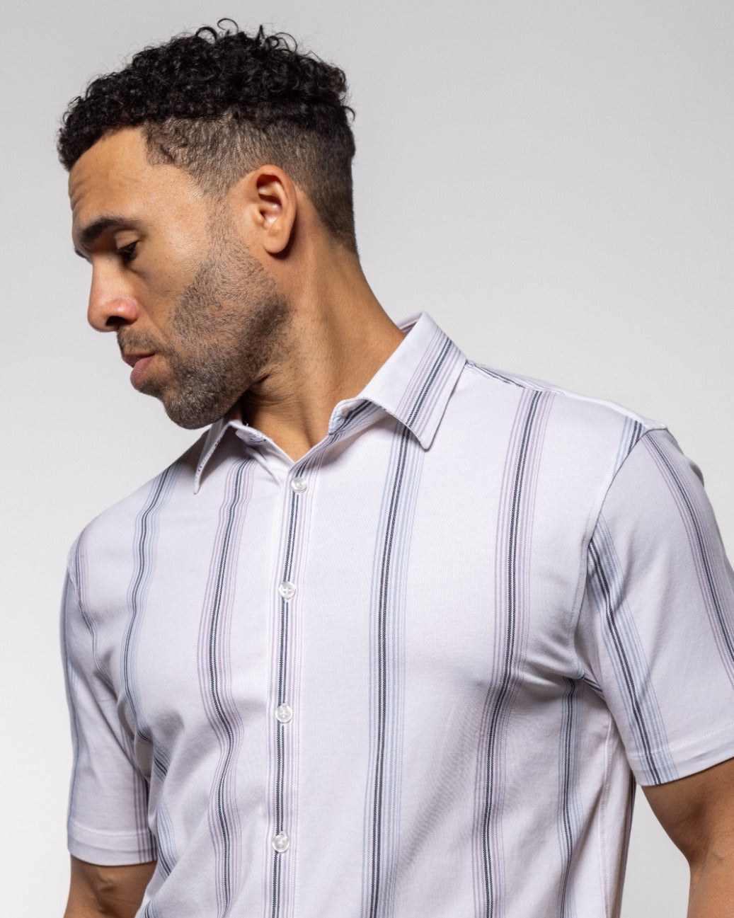 Men's white short-sleeve button-up shirt with light-blue vertical stripe detail and collar