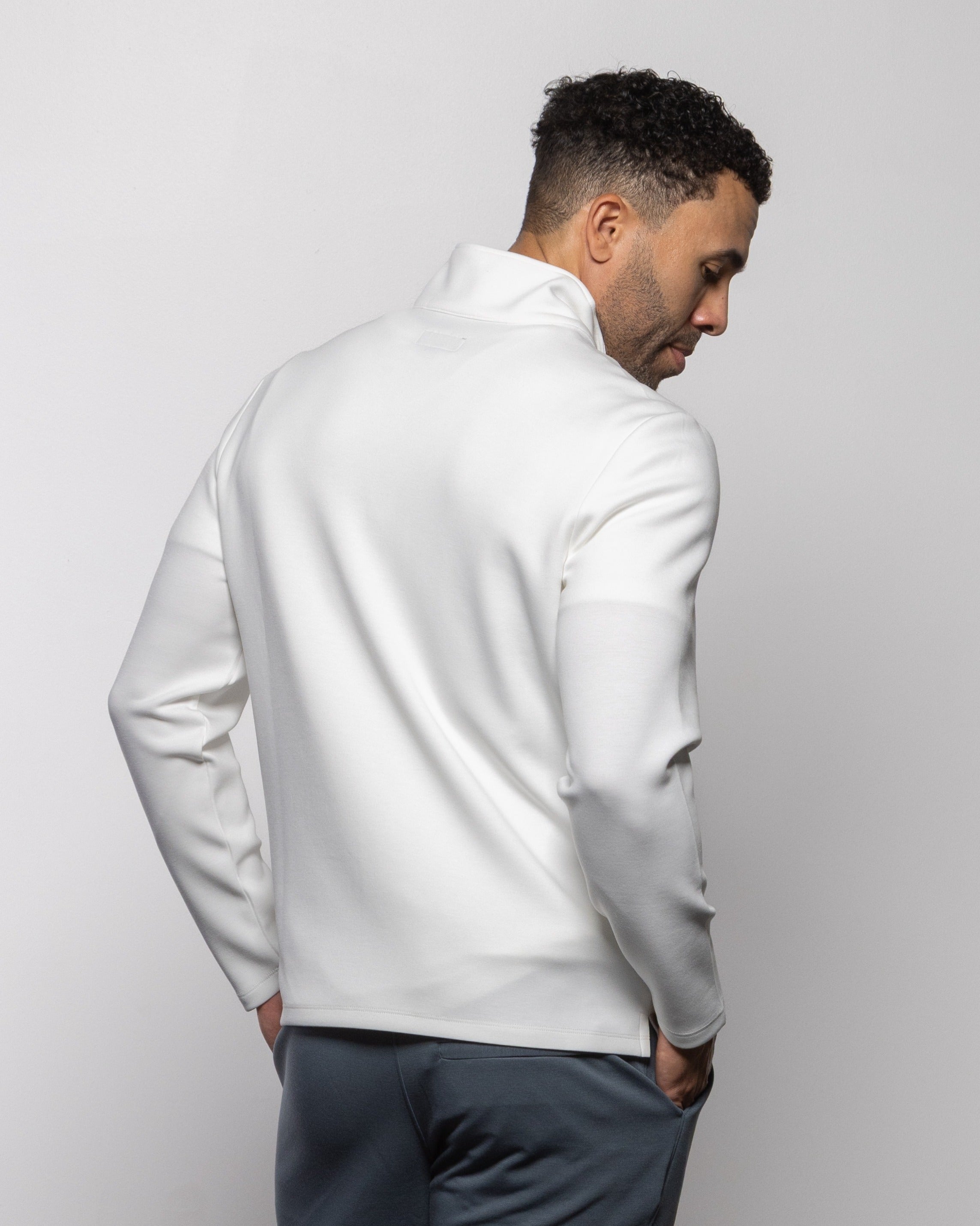 Men's summer white quarter-zip pullover, back view with stand collar