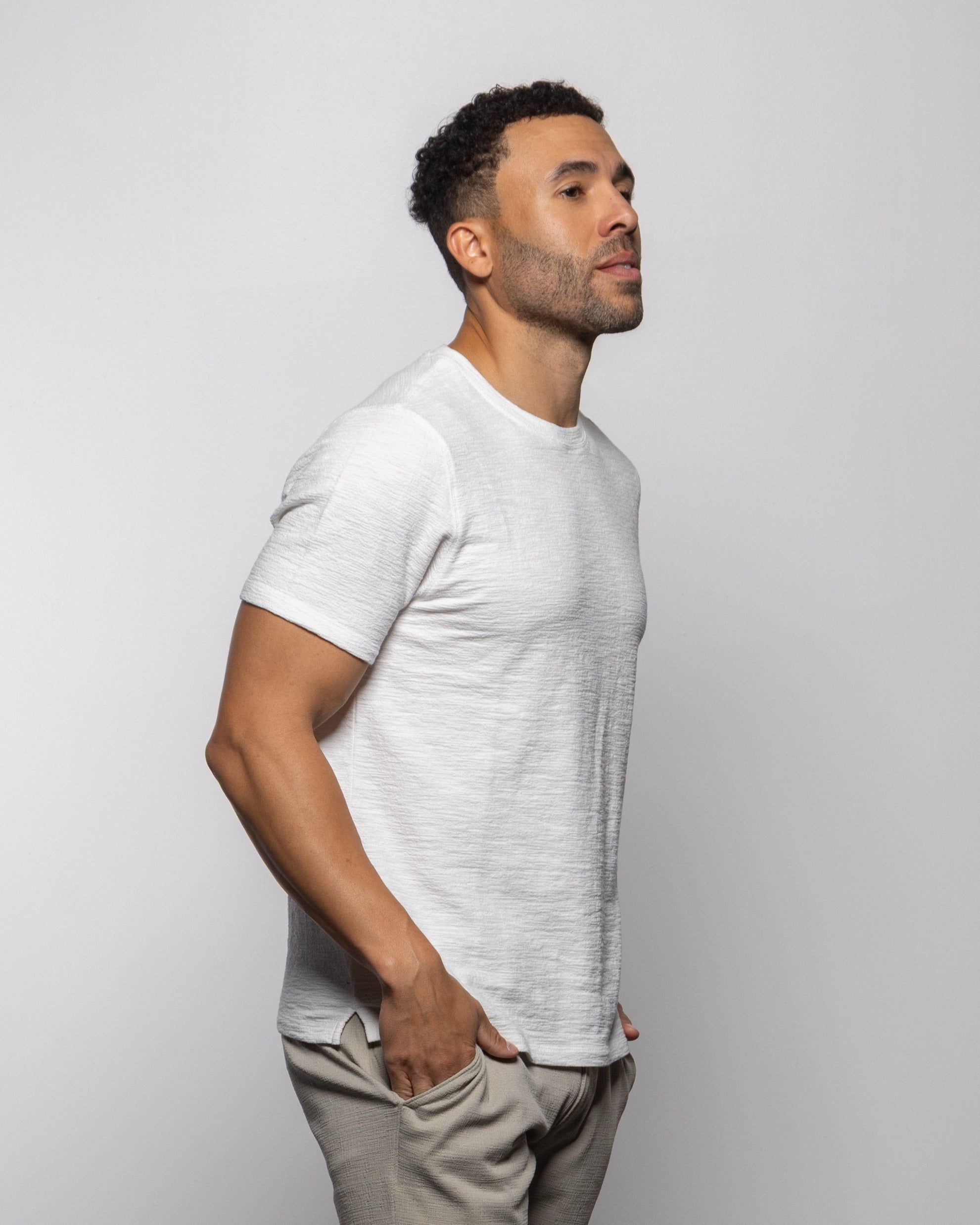 NAPA tee in summer white, short-sleeve crewneck, side view with hem and sleeves.