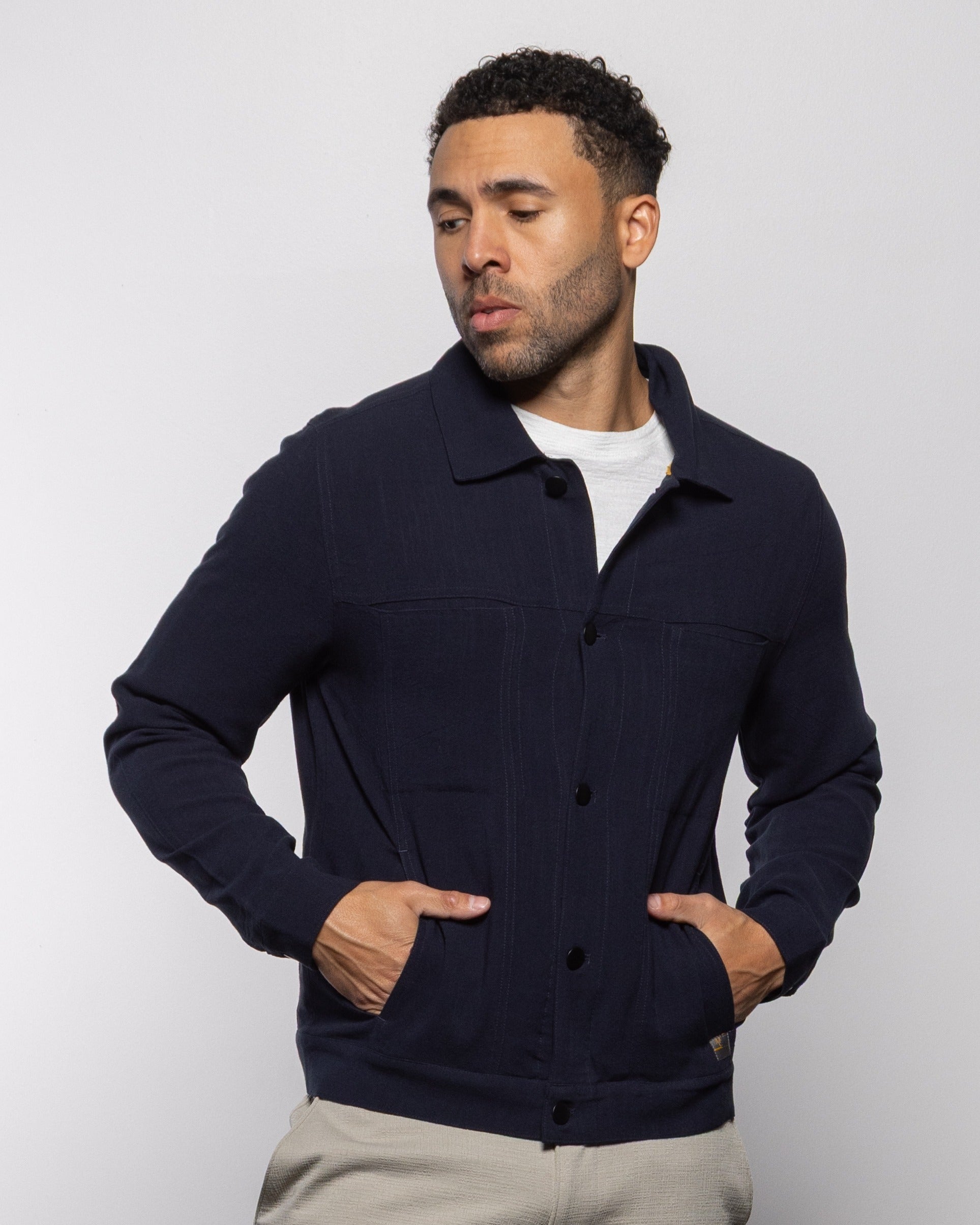 Indigo trucker jacket with buttoned front and side flap pockets