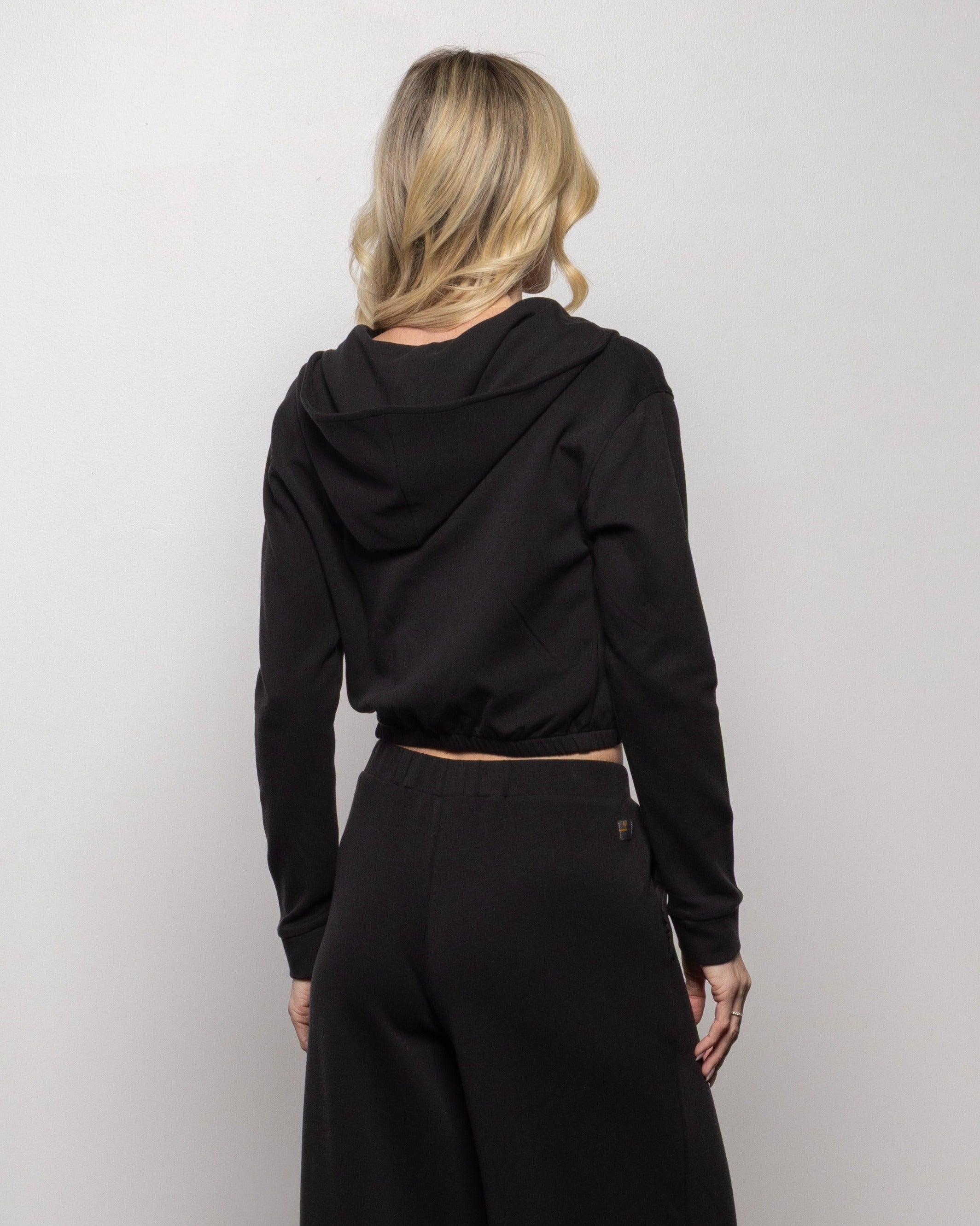 Black cropped zip hoodie, back view with hood