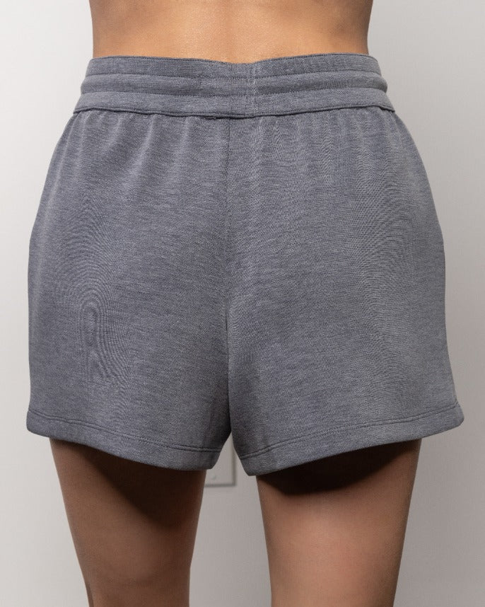 Heather gray shorts with wide elastic waistband and curved hem, back view