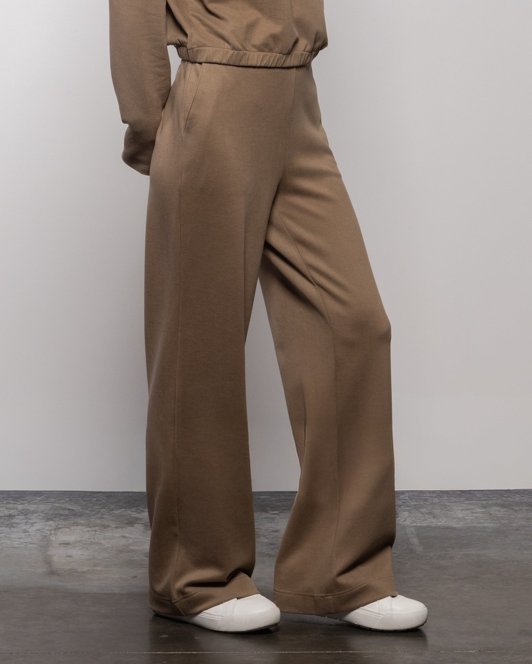 Wood brown wide-leg alpine pants, side view with elastic waistband