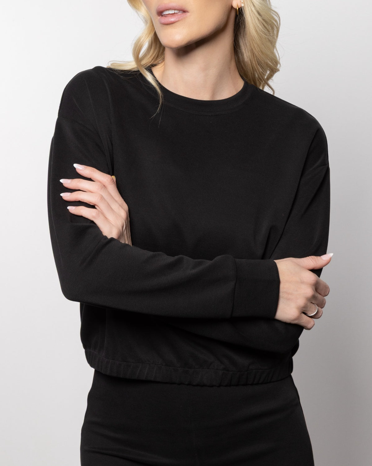 Jet black mock-neck sweatshirt with elasticated cuffs and relaxed fit