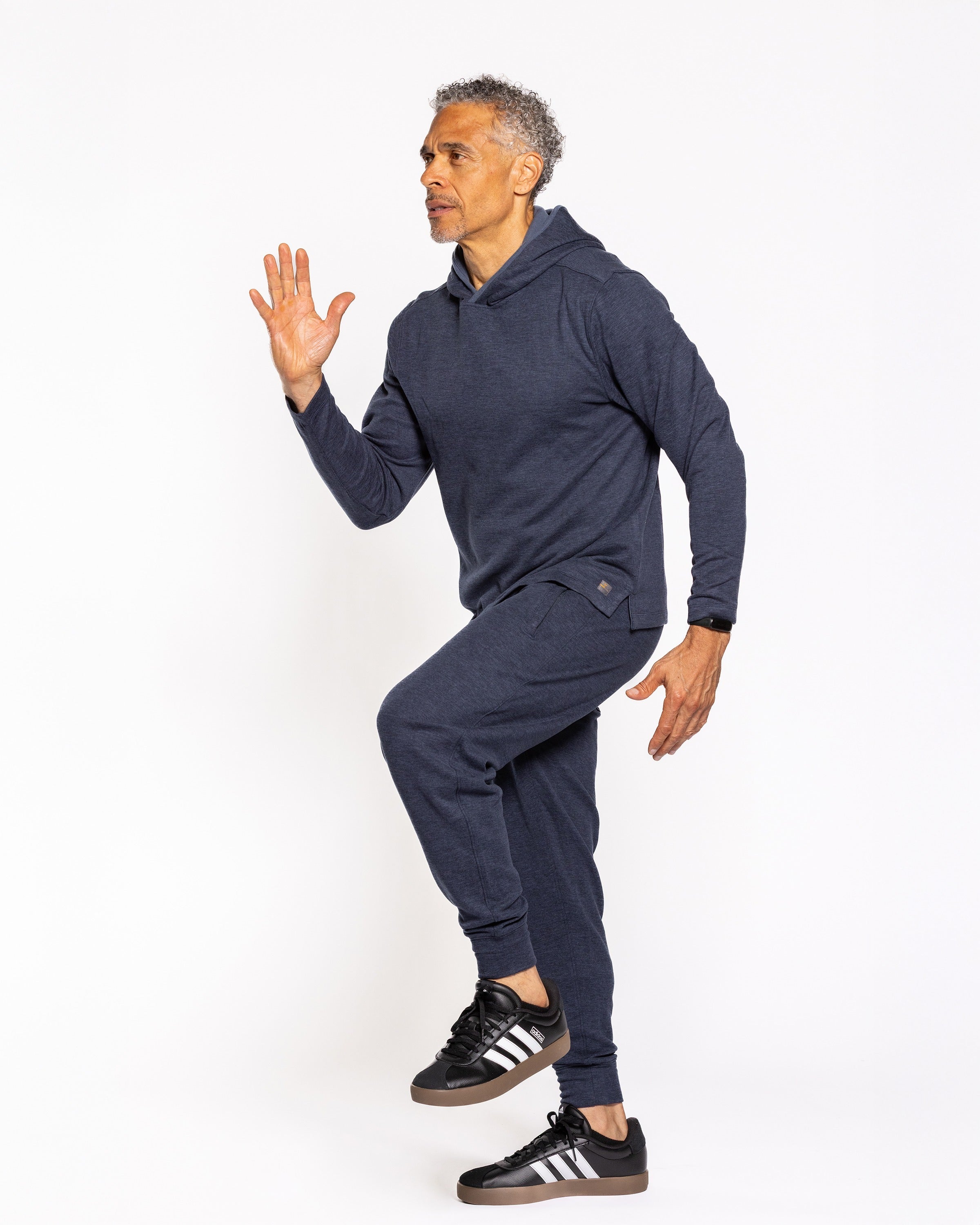 Men's indigo night hoodie with drawstring hood and kangaroo pocket, full-body side view