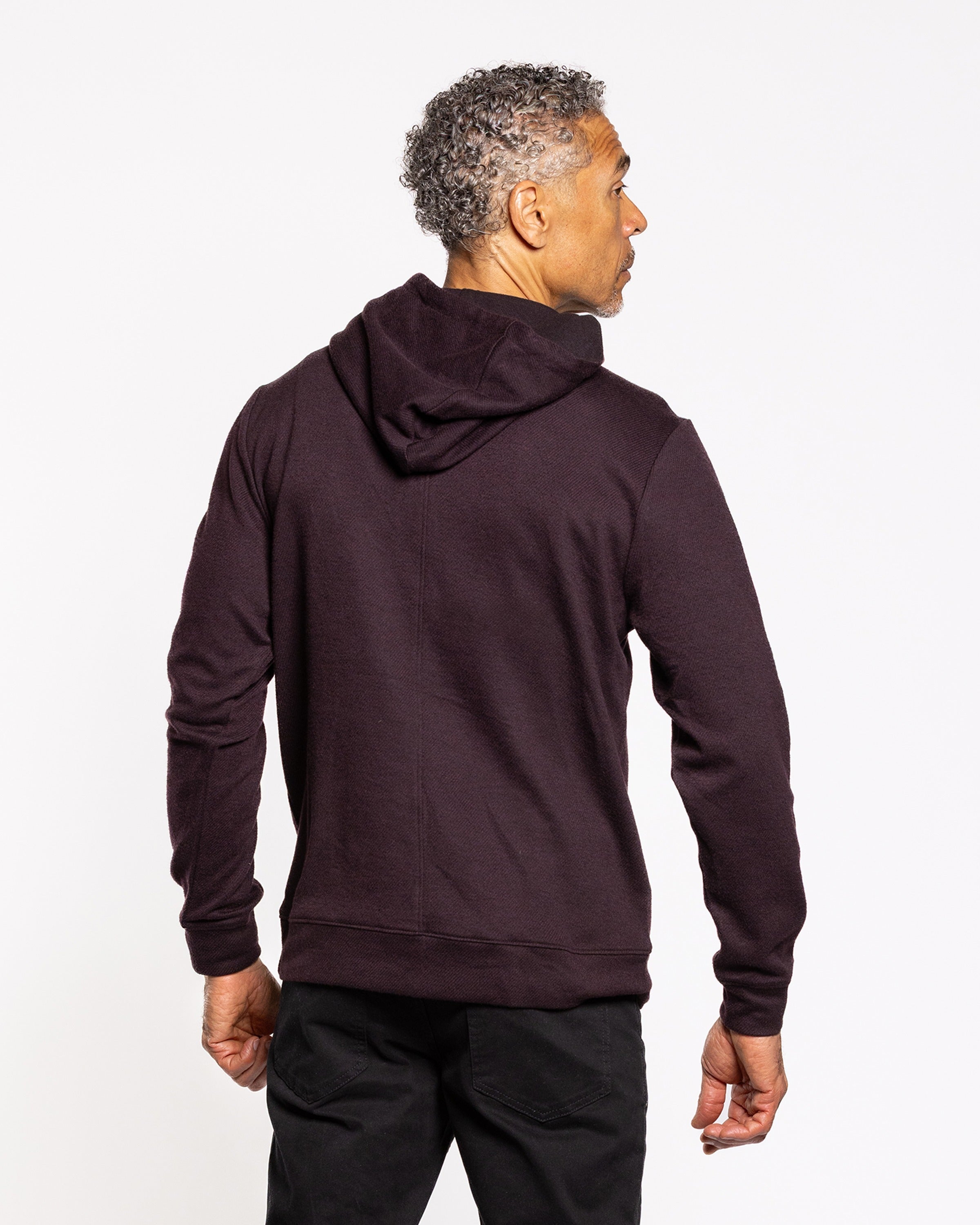 Men's dark wine twill pullover hoodie, back view with hood and ribbed hem