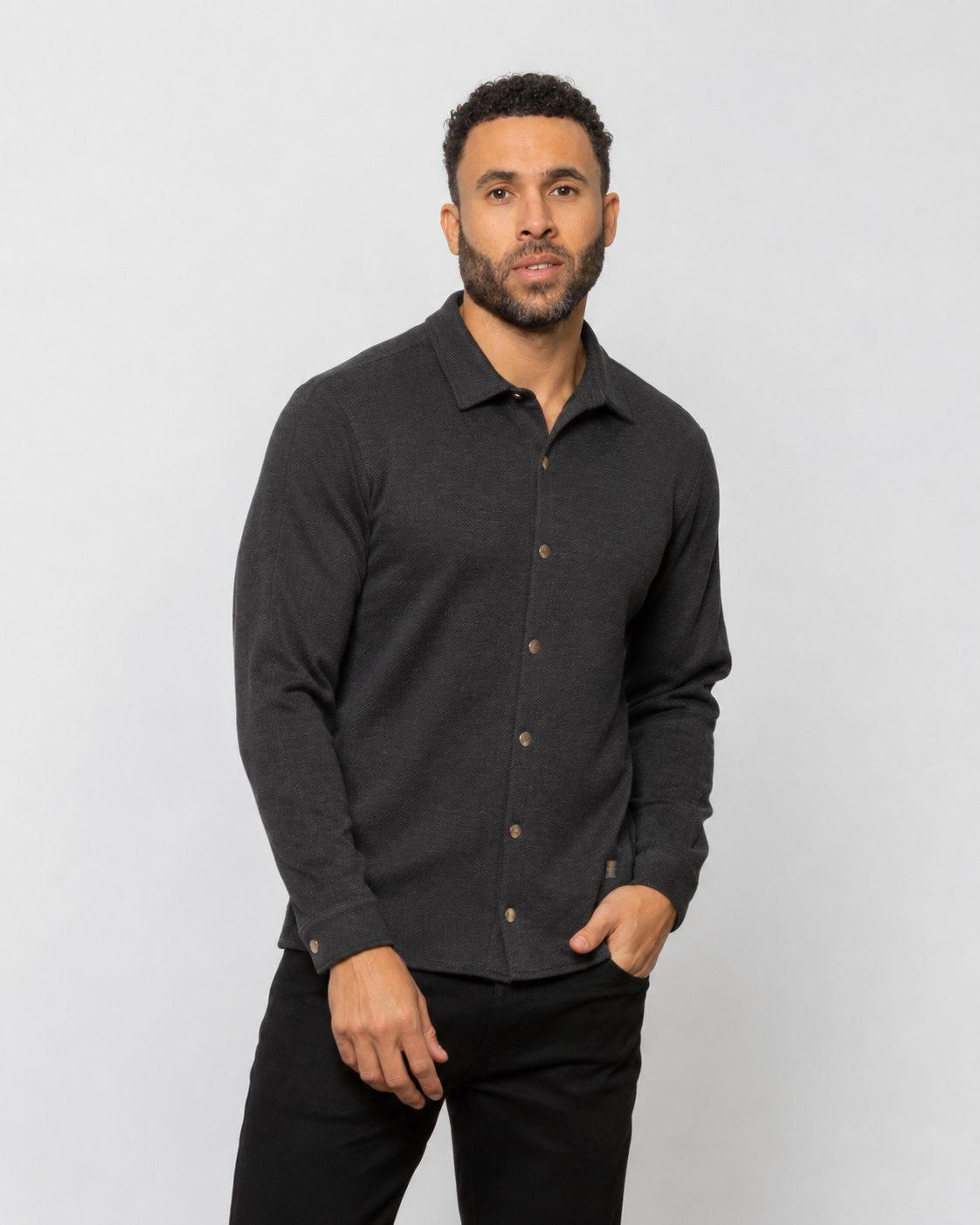Dark shirt jacket with point collar, button front, and long sleeves