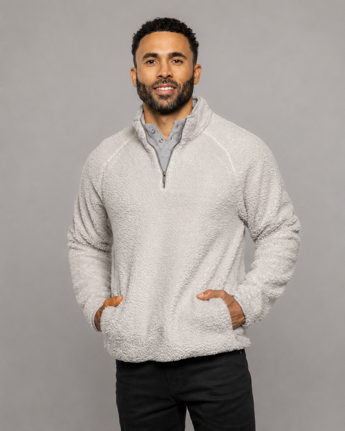 Light gray quarter-zip fleece pullover with stand collar and long sleeves, front view.