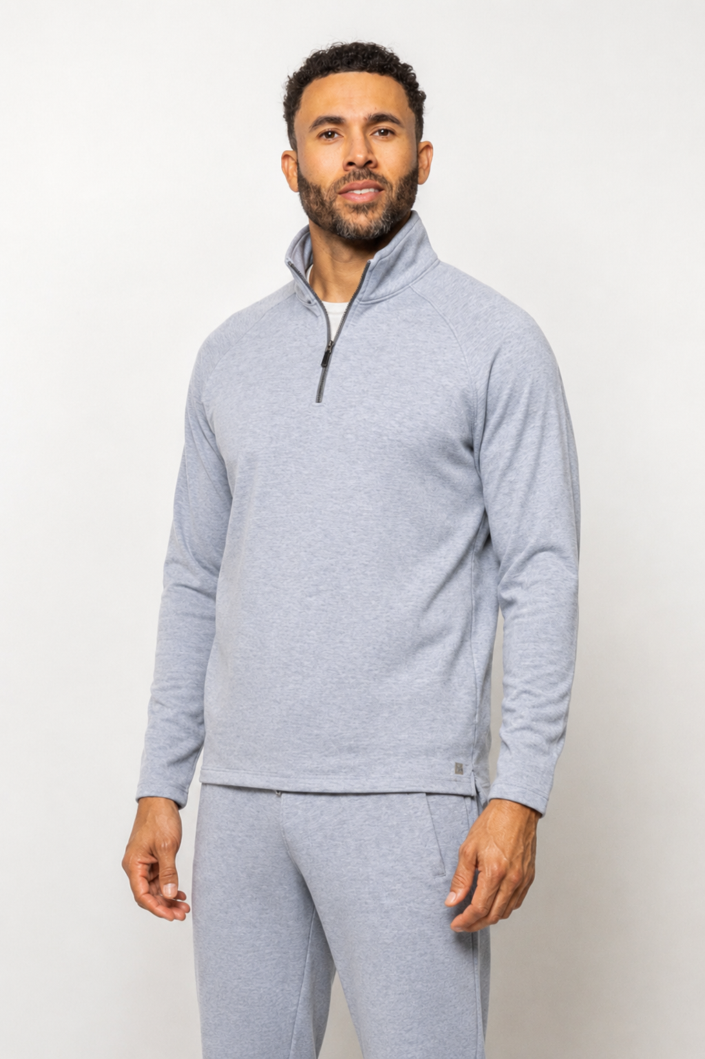 Men's heather-blue quarter-zip pullover with long sleeves and mock neck