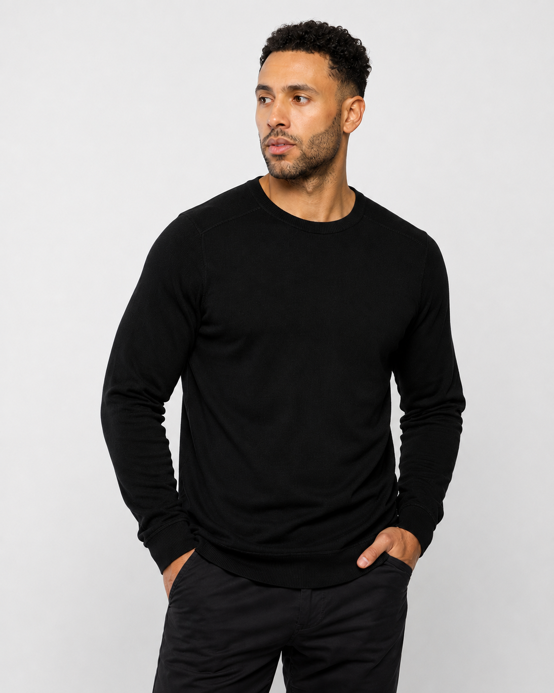 Men's jet black crewneck sweatshirt, long sleeves with ribbed cuffs and hem.