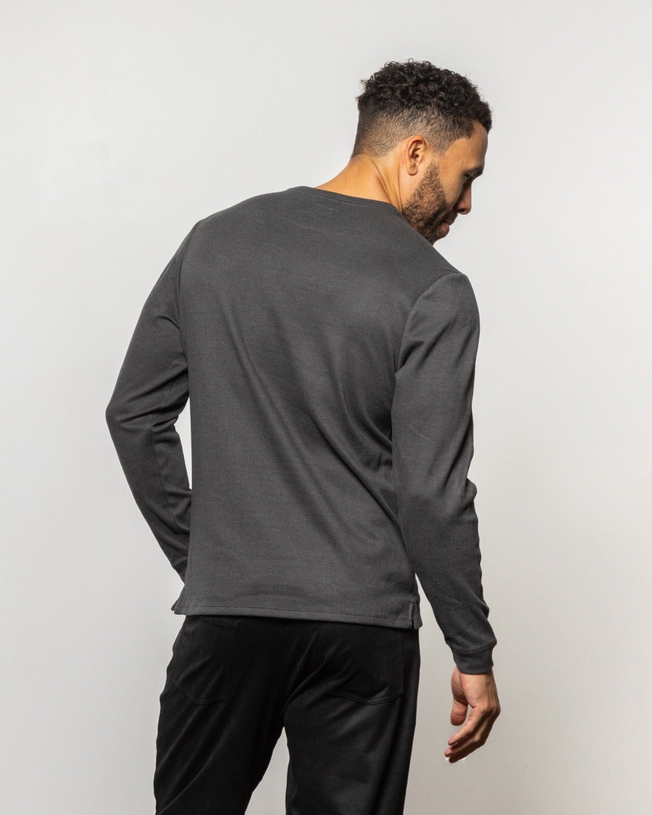 HERMOSA crewneck sweatshirt in dark charcoal, long sleeves, crew neck—back view.