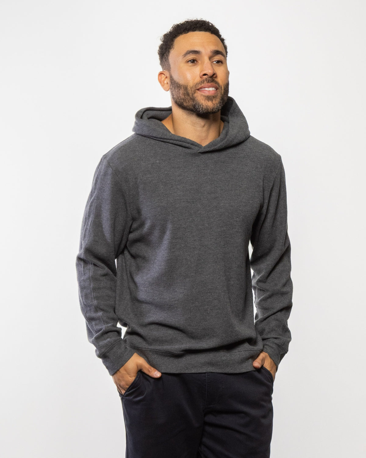 Dark gray pullover hoodie with hood and kangaroo pocket, long sleeves
