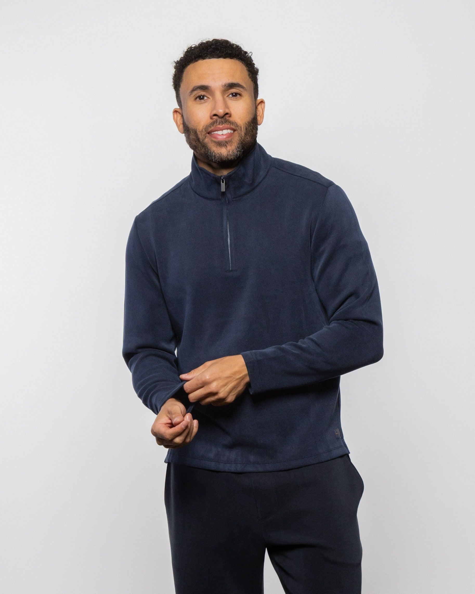 Navy quarter-zip fleece pullover with short zipper and mock neck, long sleeves