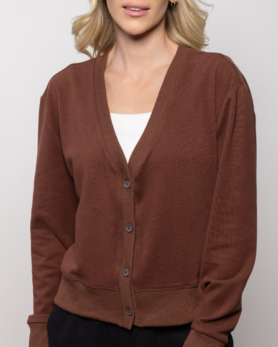 Brick red cardigan sweater with V-neck and button front, long sleeves, front pockets