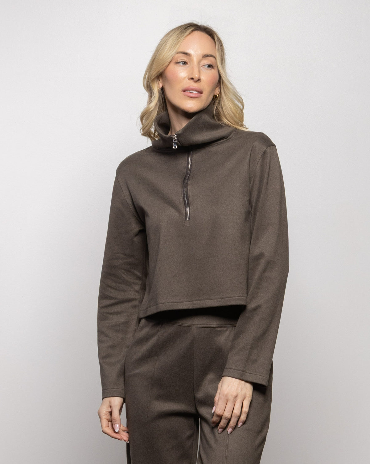 Brown half-zip pullover with stand collar and long sleeves