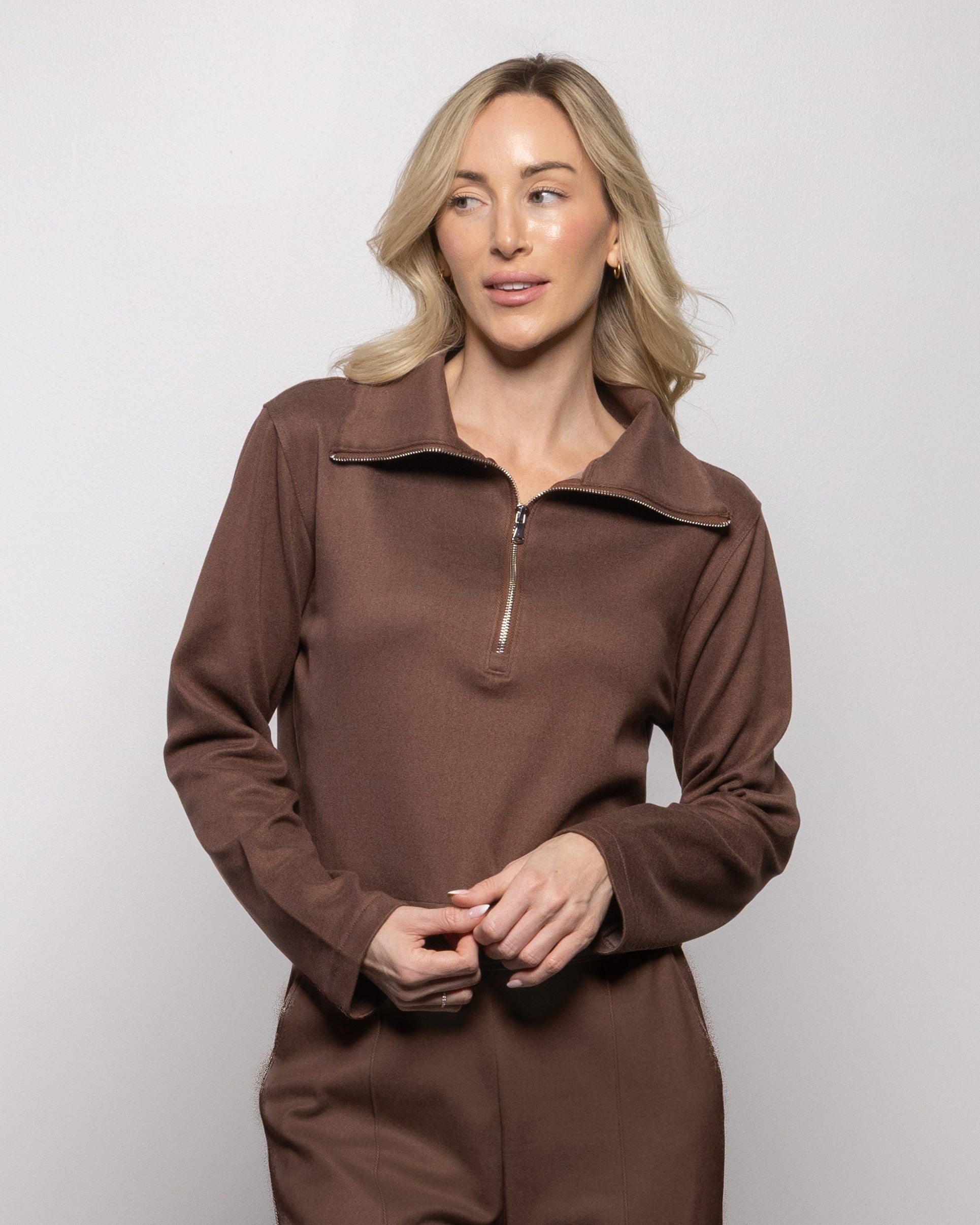 Brown half-zip pullover with mock collar, zip front, long sleeves