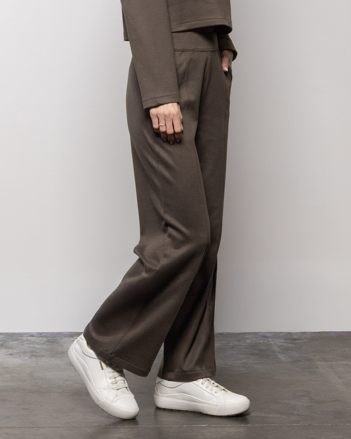 Dark wide-leg pants with relaxed fit and straight waistband