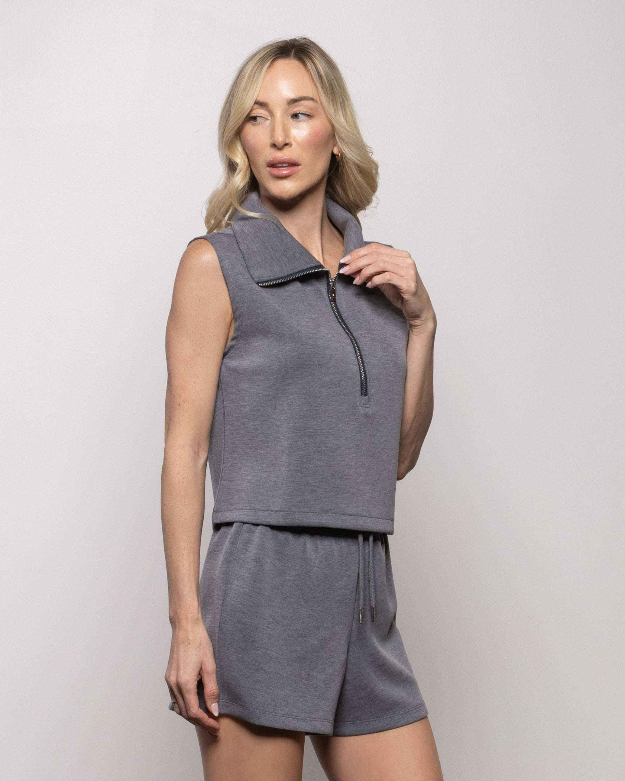 Dark gray sleeveless half-zip tank top with stand collar and slim zipper