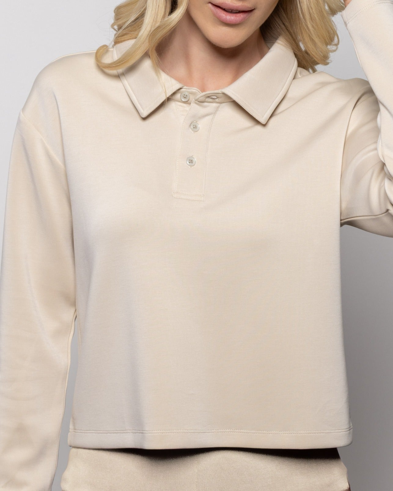 Birch polo shirt close-up, button placket, raised collar, small chest logo