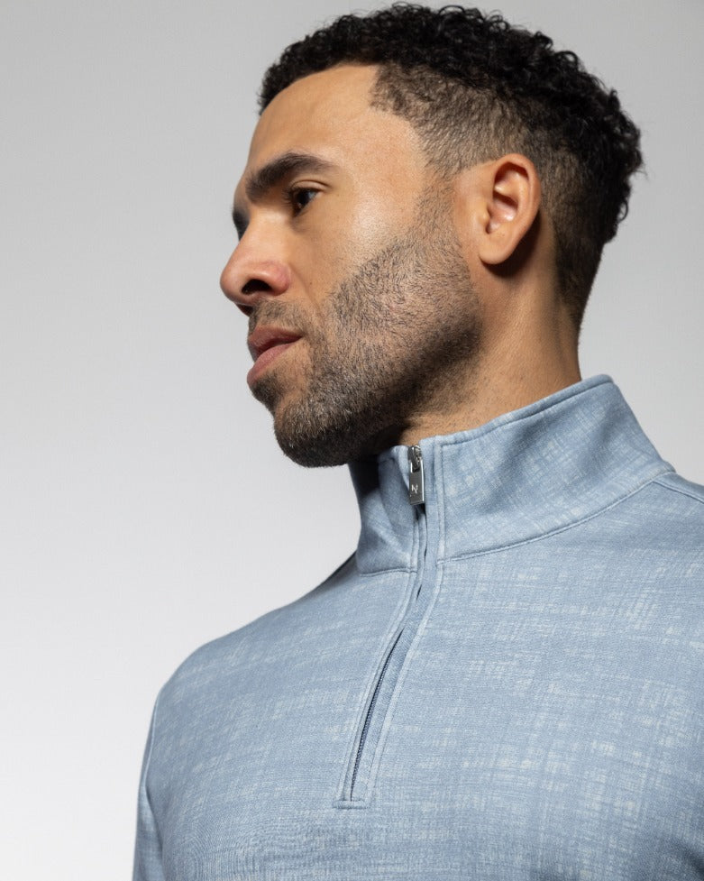 Men's light-blue quarter-zip sweater close-up of zip collar and half-zip