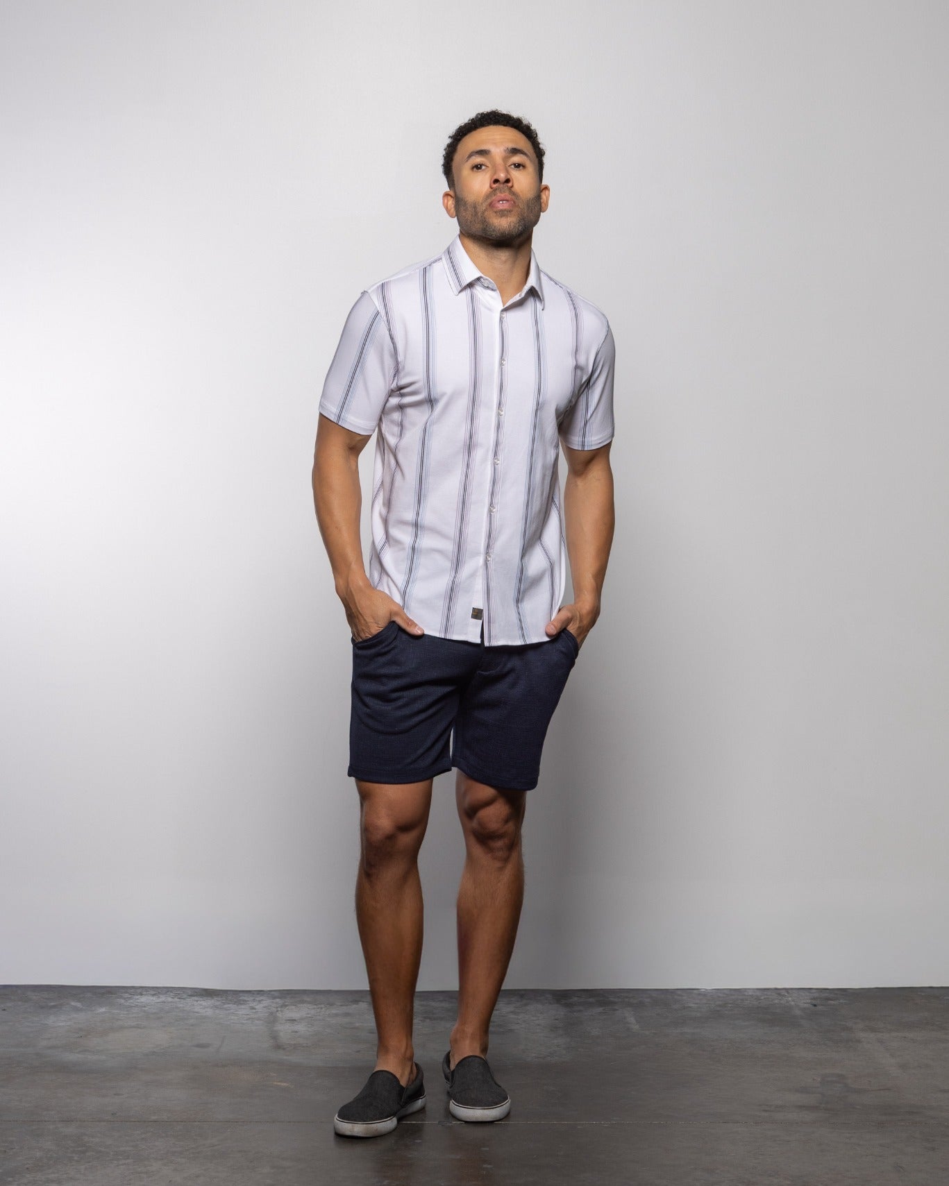 Men's white short-sleeve button-up shirt with vertical light-blue stripes, front view