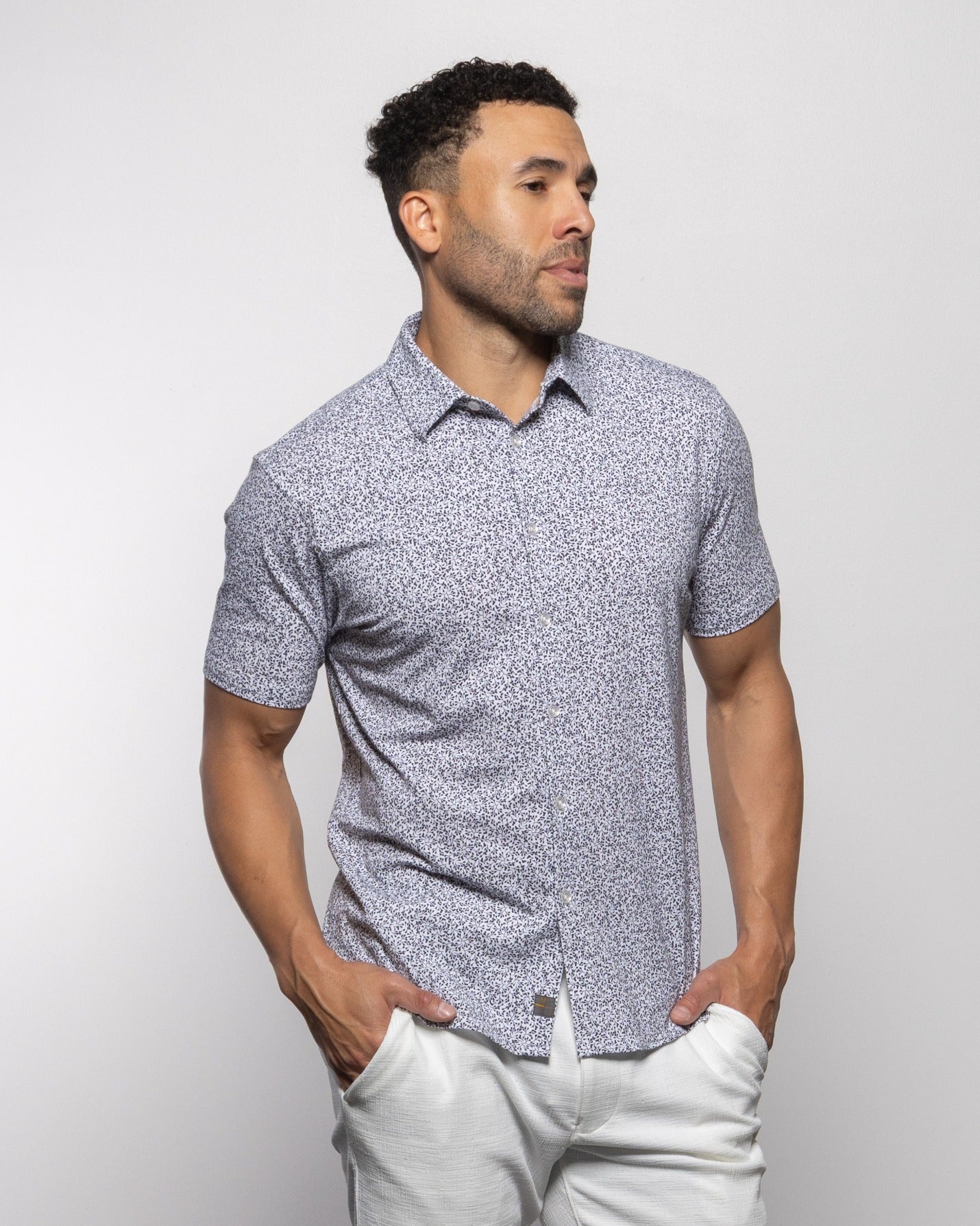 Heathered short-sleeve polo with collar and button placket, navy speckle