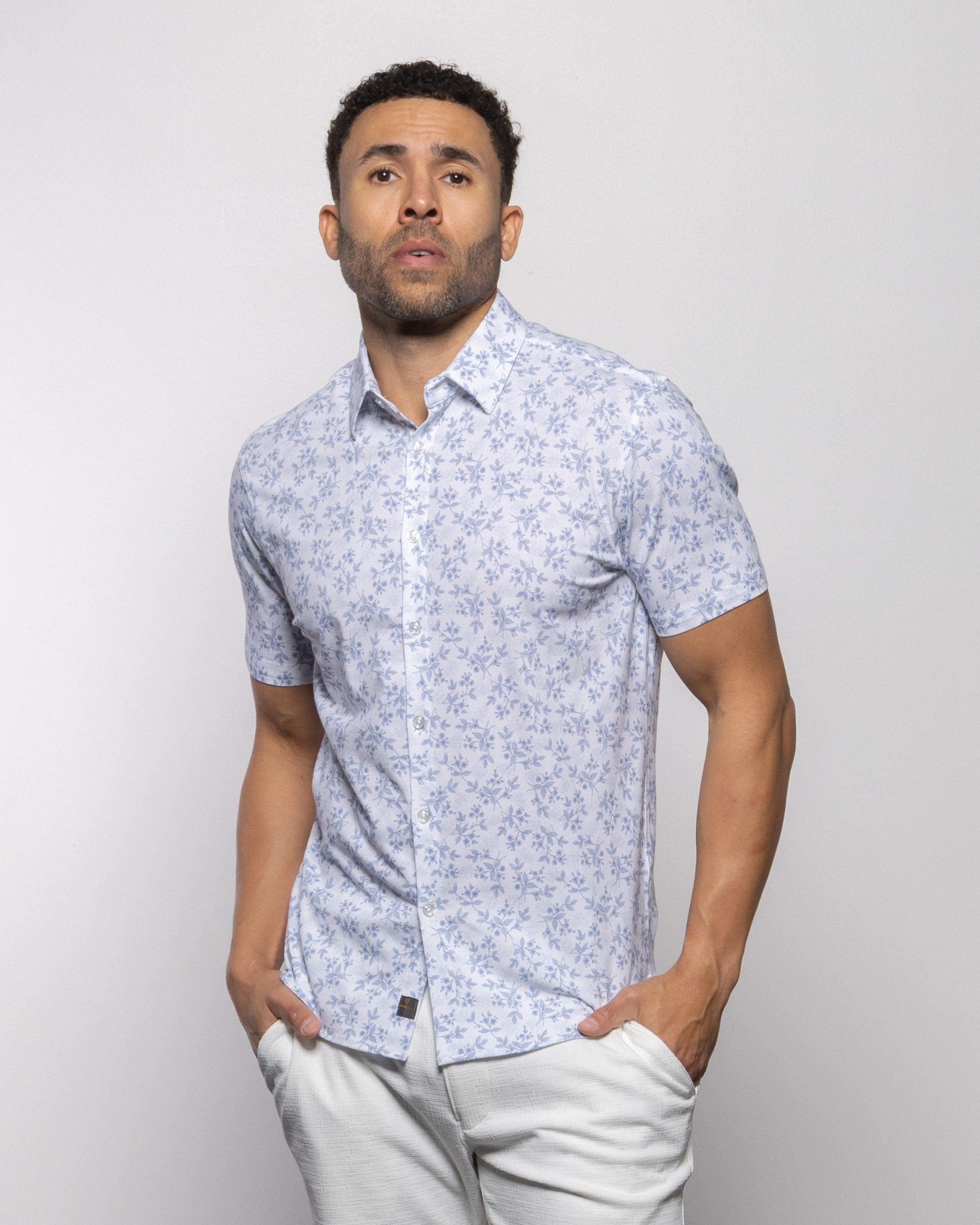 Light blue floral short-sleeve polo with collar, button placket and chest pocket