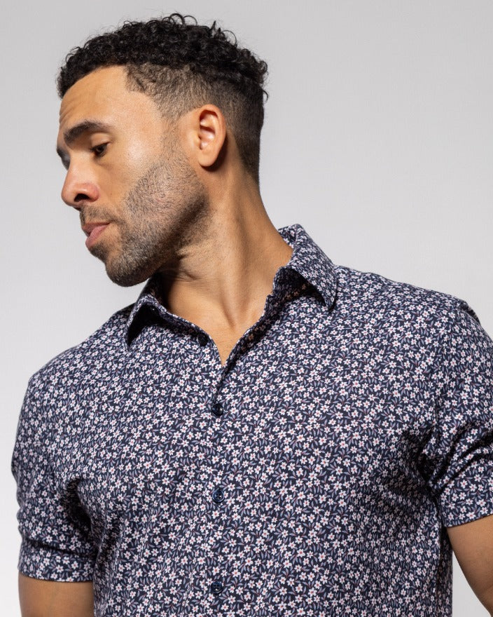 Men's short-sleeve button-up shirt in dark indigo with small floral print