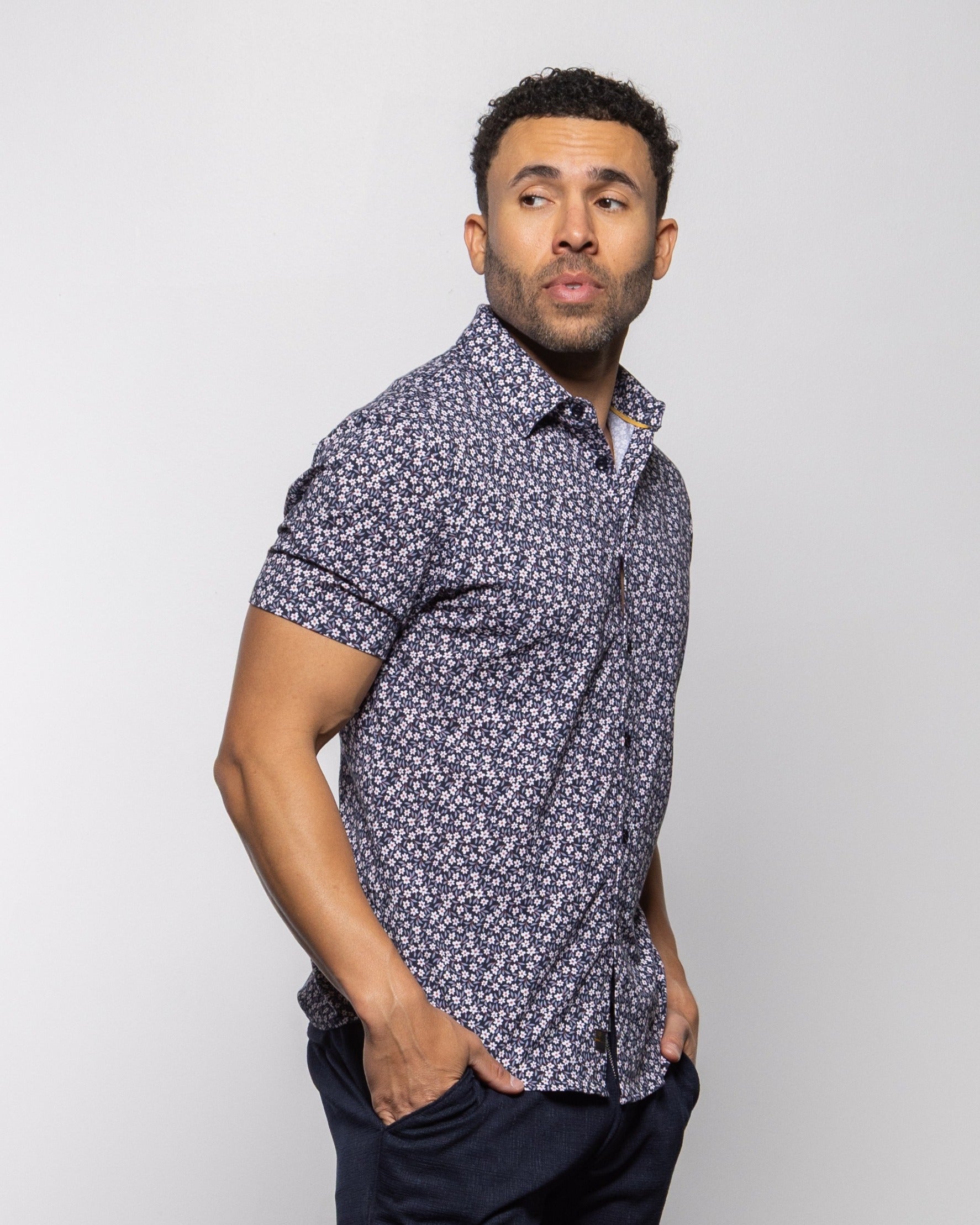 Men's indigo floral short-sleeve button-up shirt with buttoned collar