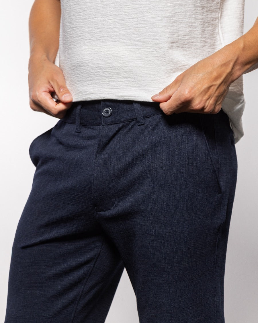 Milan Beach pant in indigo night, close-up waistband with button and belt loops