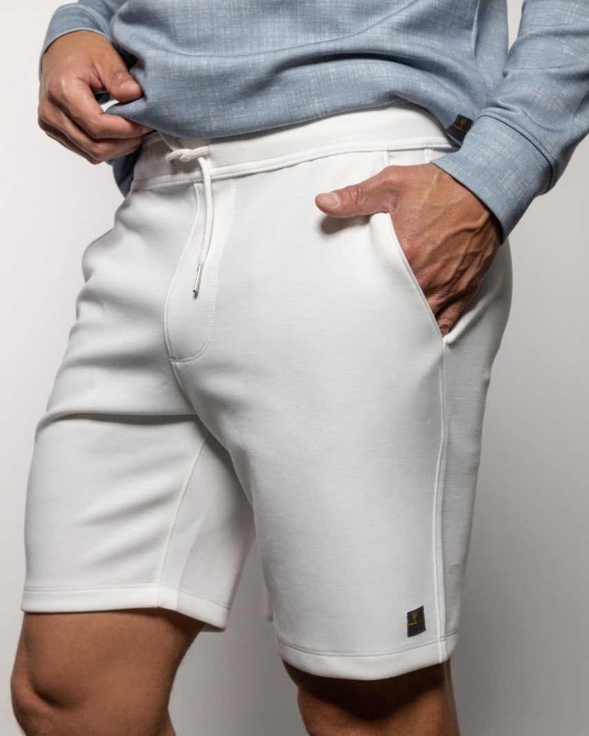 Men's white drawstring shorts with side pockets, cuffed hem