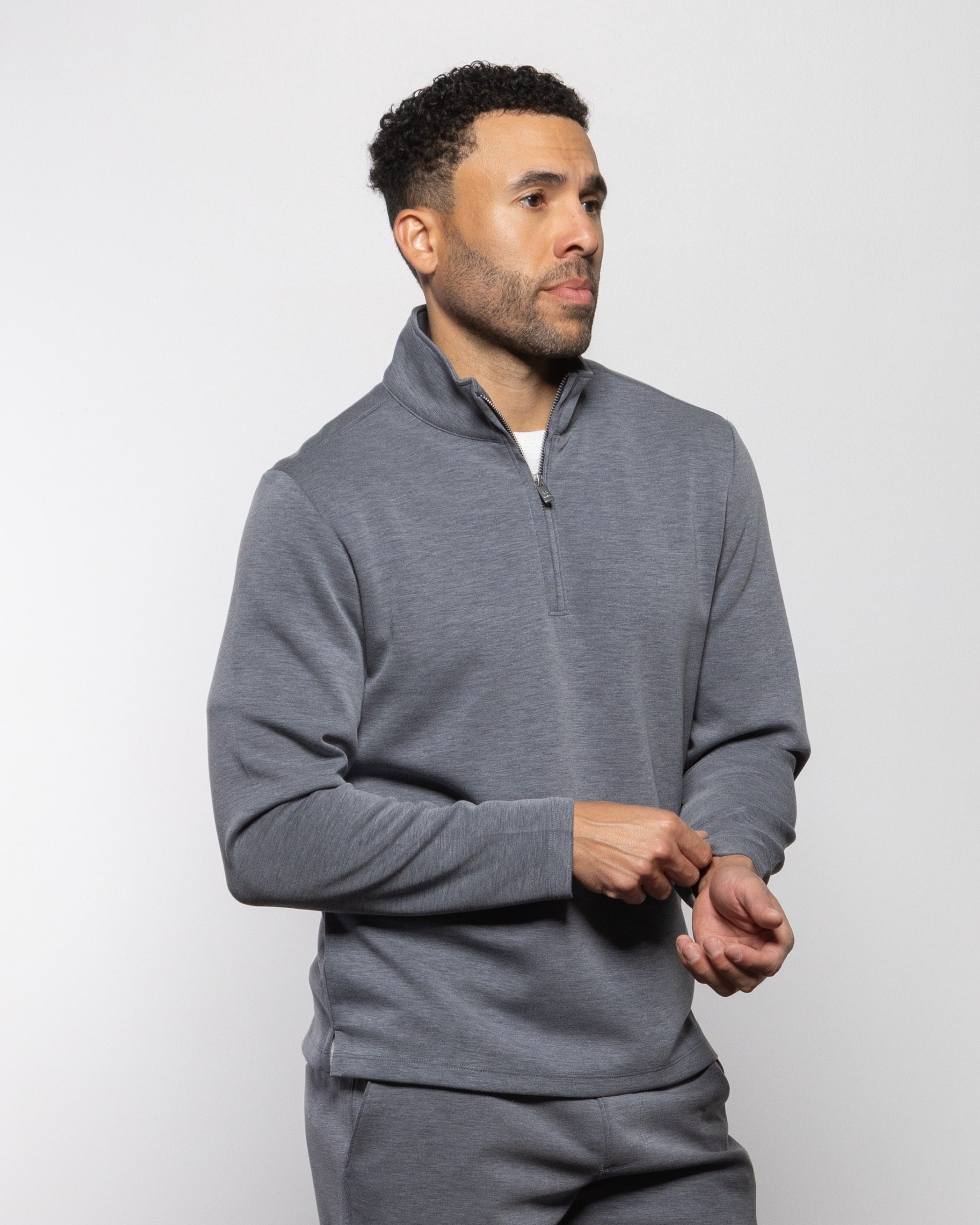 Gray quarter-zip sweatshirt with long sleeves and half-length front zipper