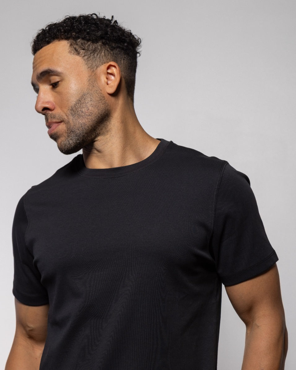 Jet black crew-neck short-sleeve T-shirt on model, front view