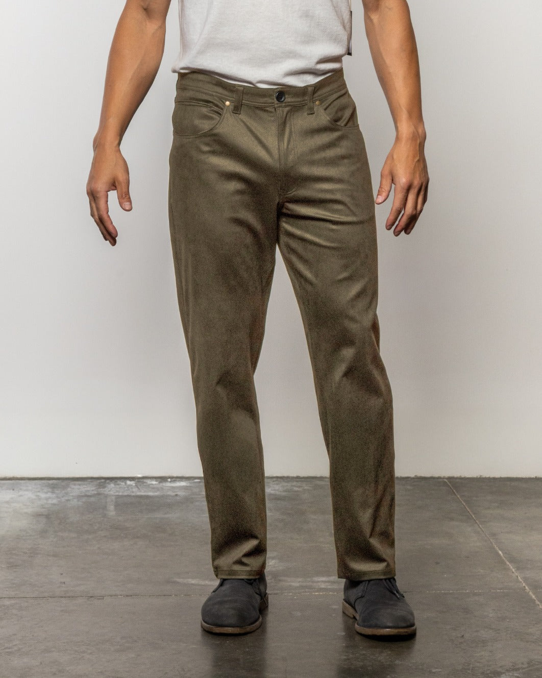Olive-green denim jeans with straight legs, five pockets, button fly, front view