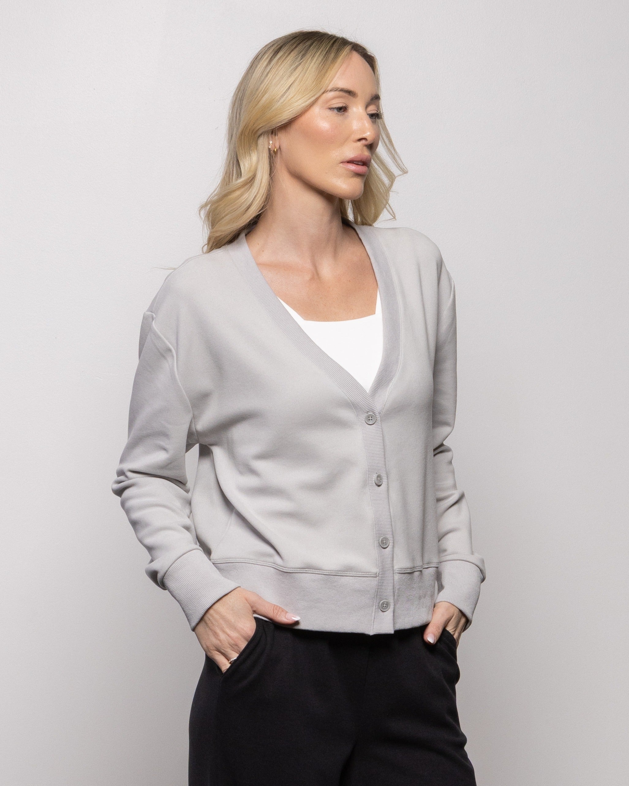 Alpine cardigan in cement gray, open V-neck with button placket and long sleeves