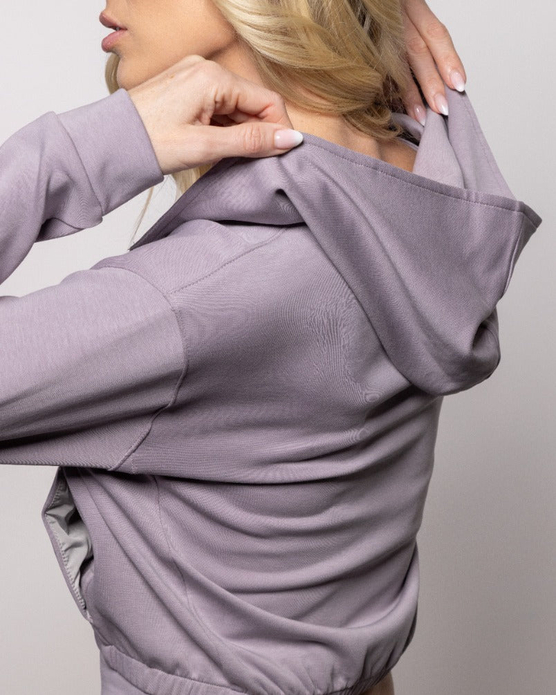 Lavender zip-up hoodie with adjustable hood and front pockets