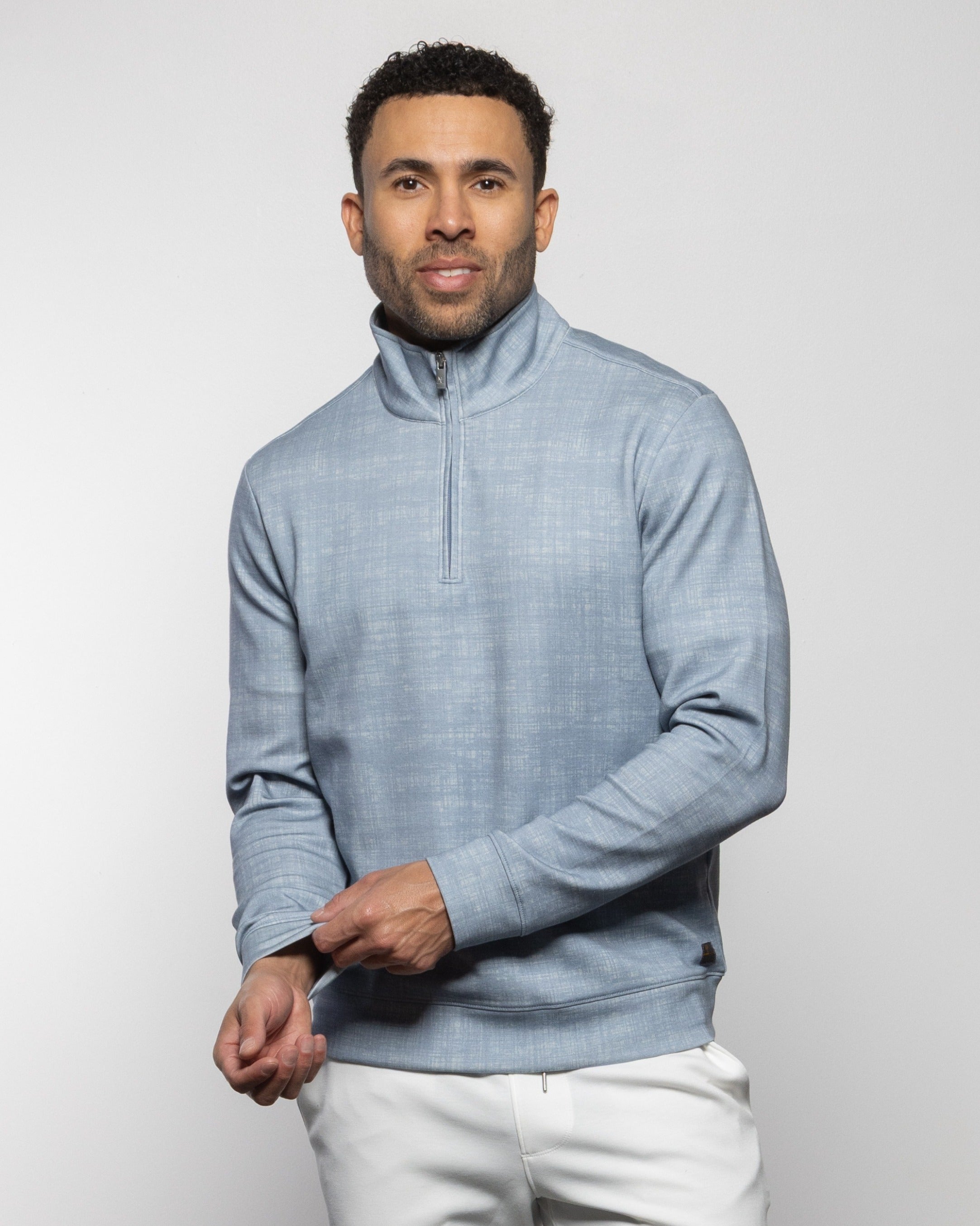 Men's light-blue quarter-zip sweater with stand collar and long sleeves