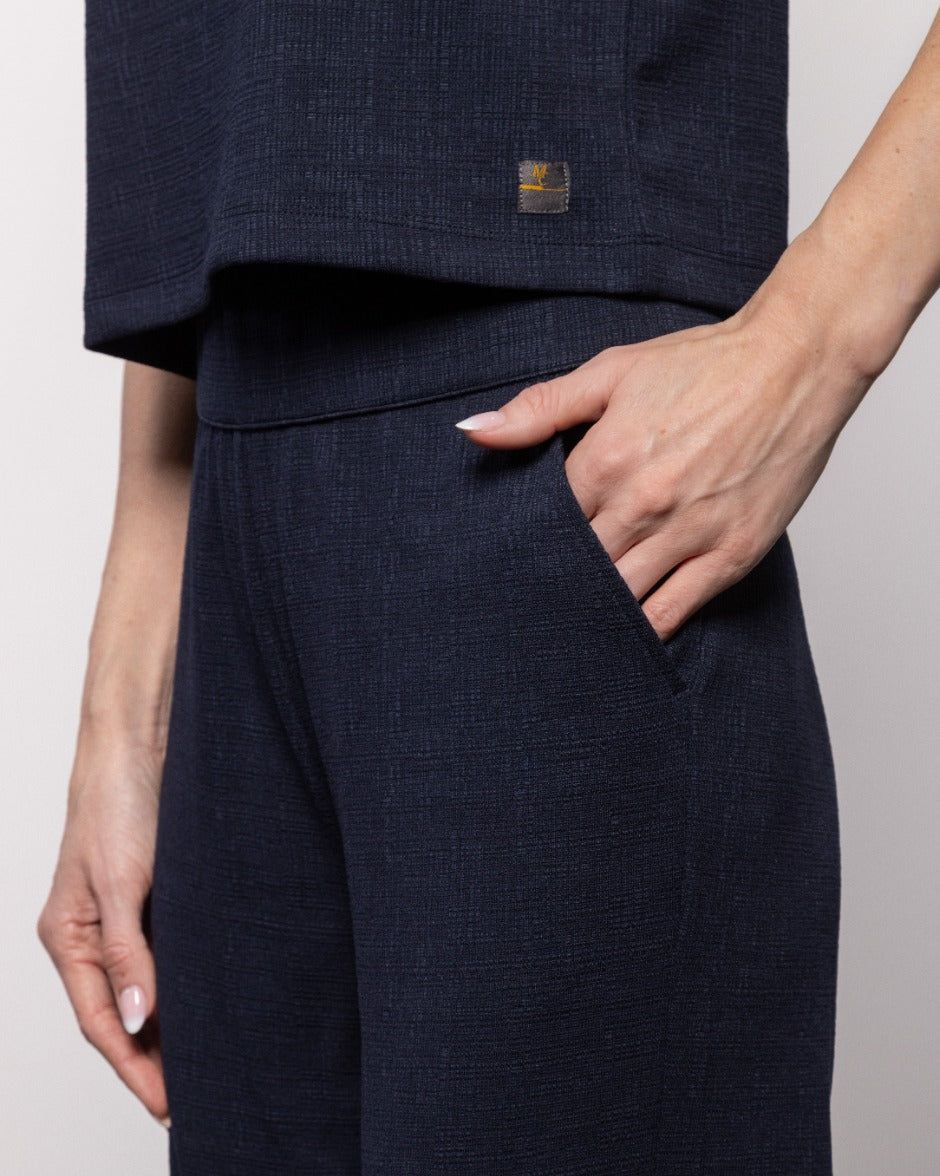 Indigo night crop pant waistband detail with side pocket and textured fabric