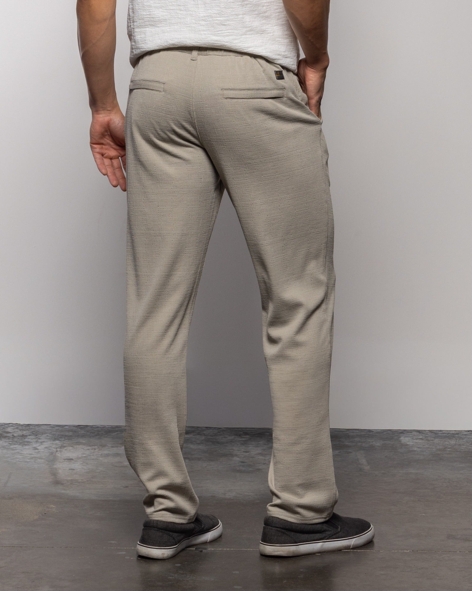 Men's quartz beach pants, back view, slim tapered leg with belt loops and pockets