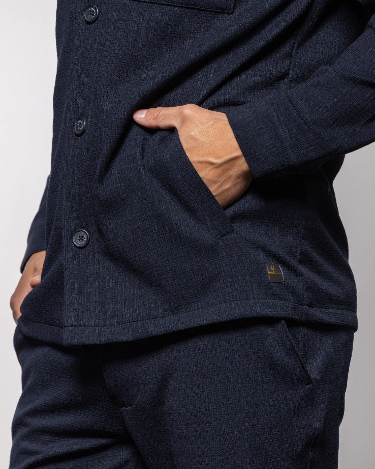 Milan indigo night jacket close-up: button placket, chest pocket, textured fabric