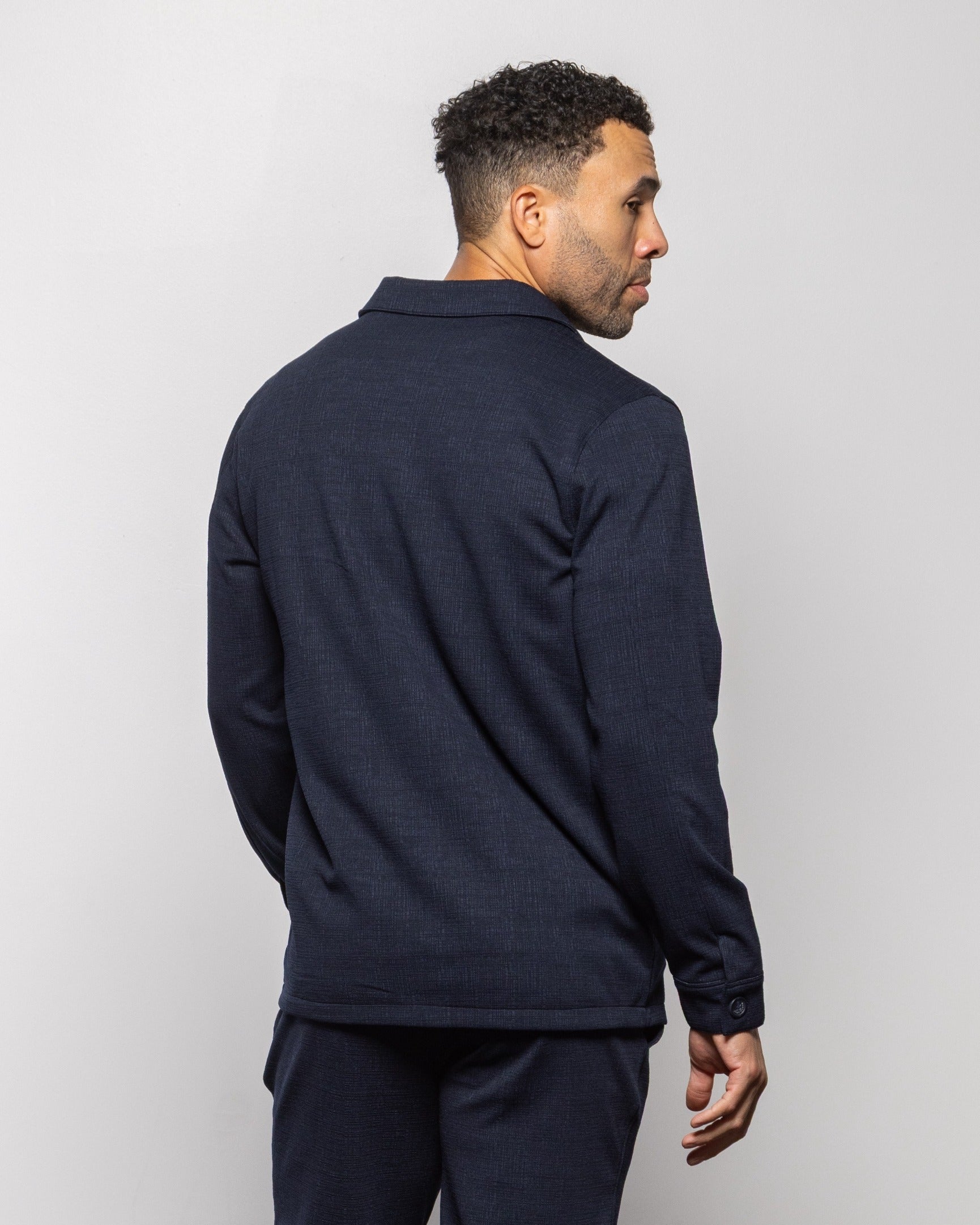 Milan indigo night jacket back view with long sleeves and button cuffs